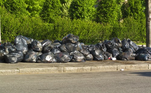 Workers safely managing builder's waste on a Blackwall construction site